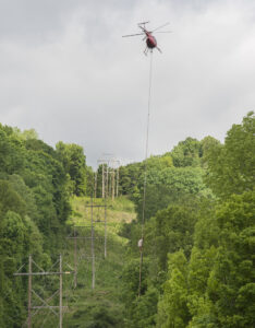 Mon Power will use saws suspended from helicopters to trim trees along power lines
